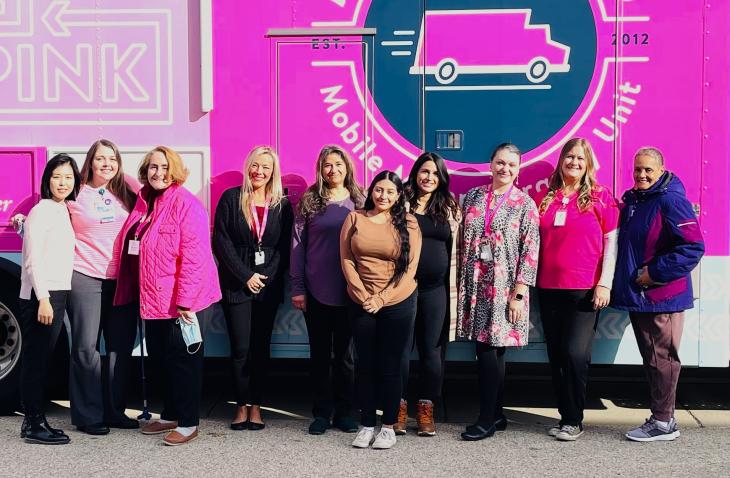 Zuri Cevallos, fourth from right, is pictured during a mobile mammogram event at The Center Clinic, where she works part-time.